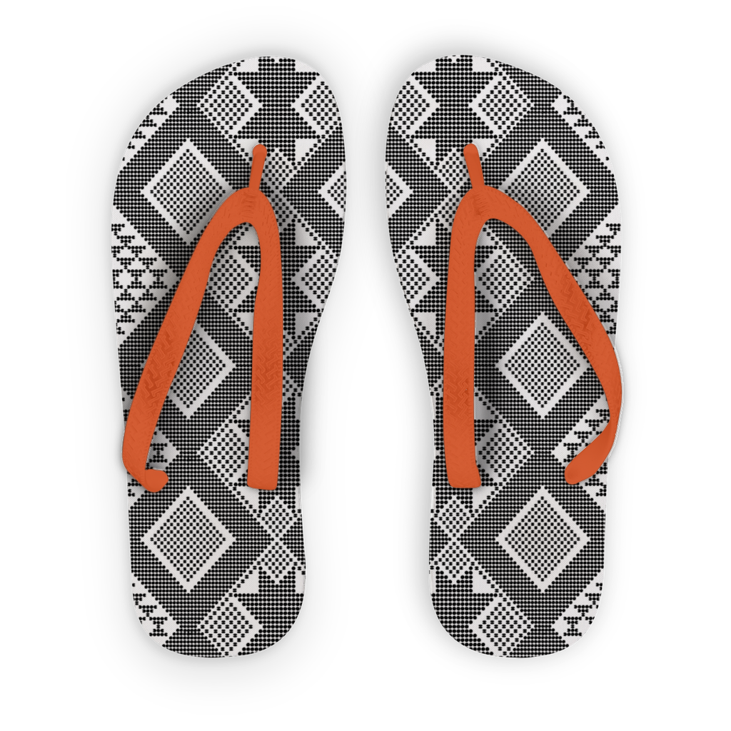 Black & white flip flop with orange strap